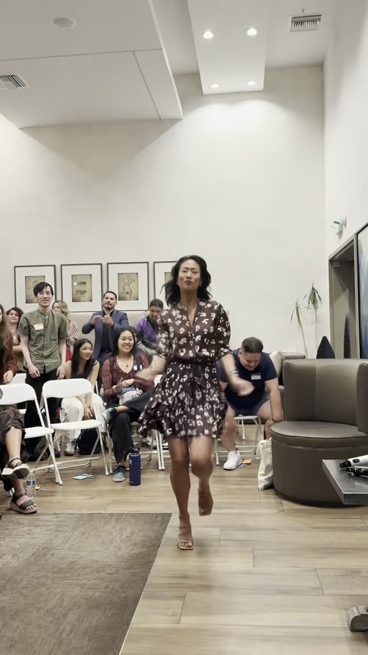 Samantha celebrating with a full workshop room
