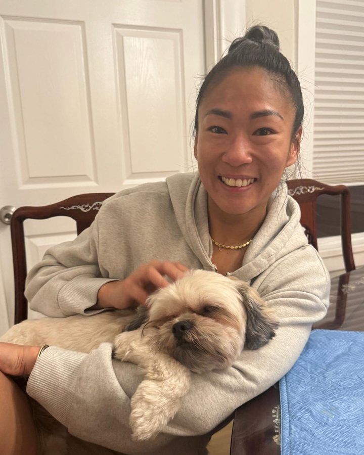 Samantha at home with her dog on her lap