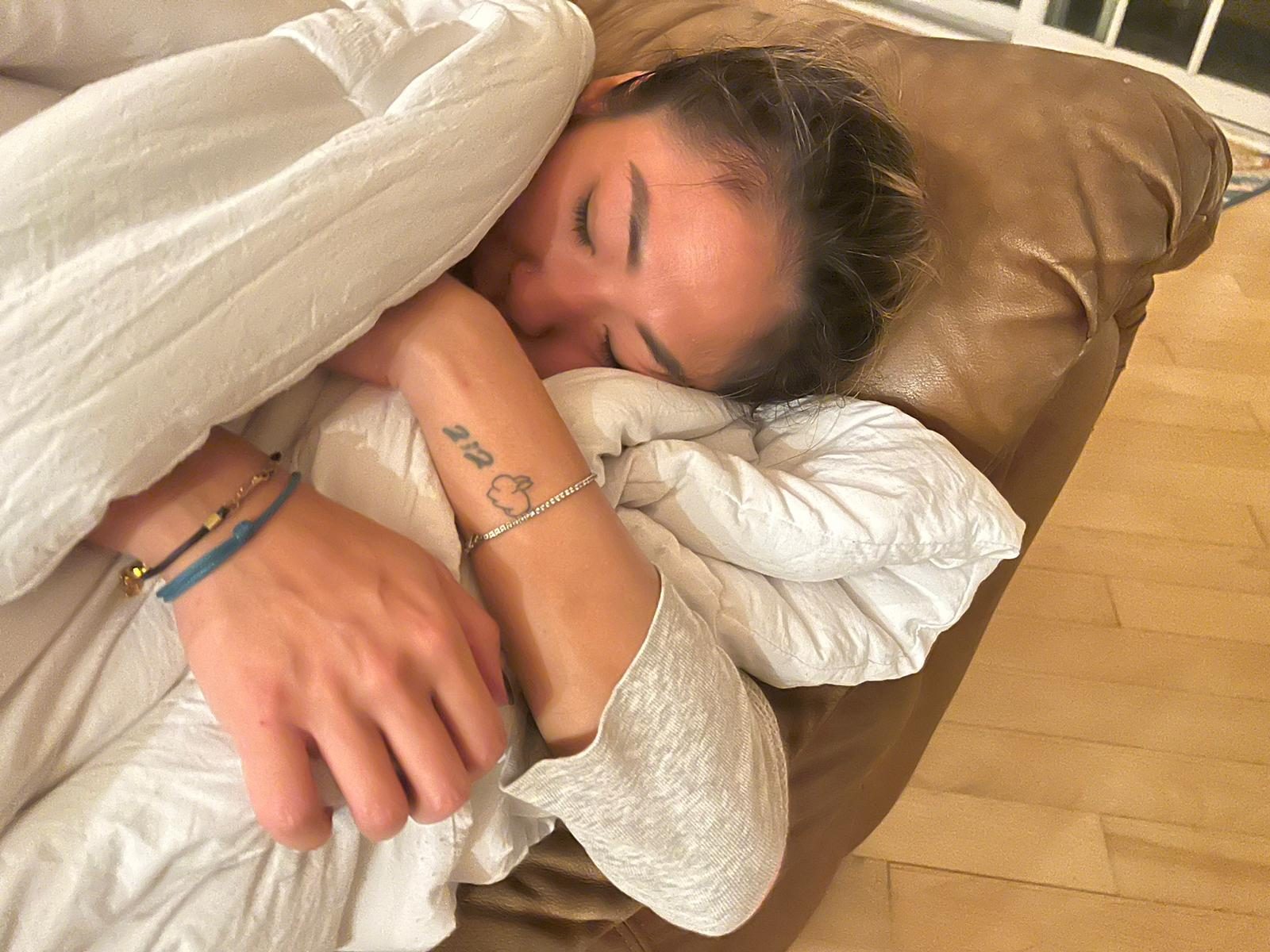 Samantha asleep, face in a pillow